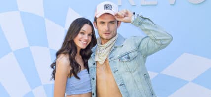 James Kennedy and Ally Lewber posing on the red carpet.