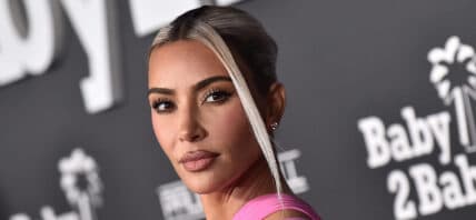 Kim Kardashian posing on the red carpet.