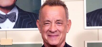 Tom Hanks posing on the red carpet.