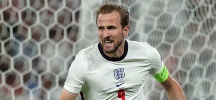 Harry Kane representing England's national team against Denmark