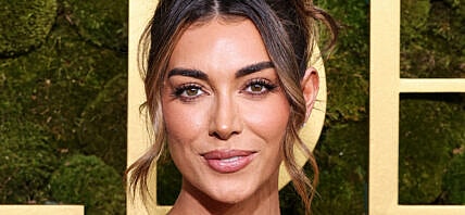 Brianna LaPaglia posing on the red carpet.