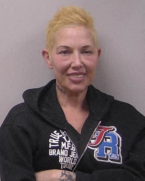 Eminems ex-wife Kim Scott smiles in mug shot after second DUI arrest on May 14