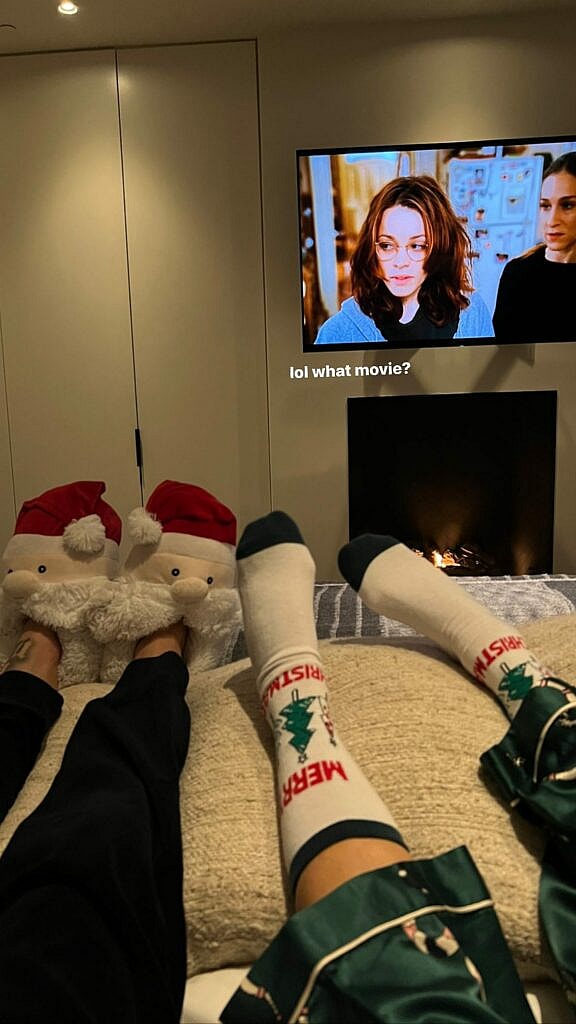 Travis Barker and Kourtney Kardashian lounging in bed.
