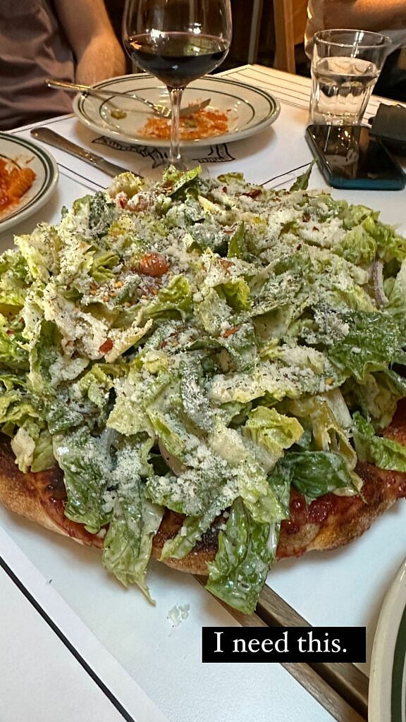 Emily Elizabeth showing off her pizza.