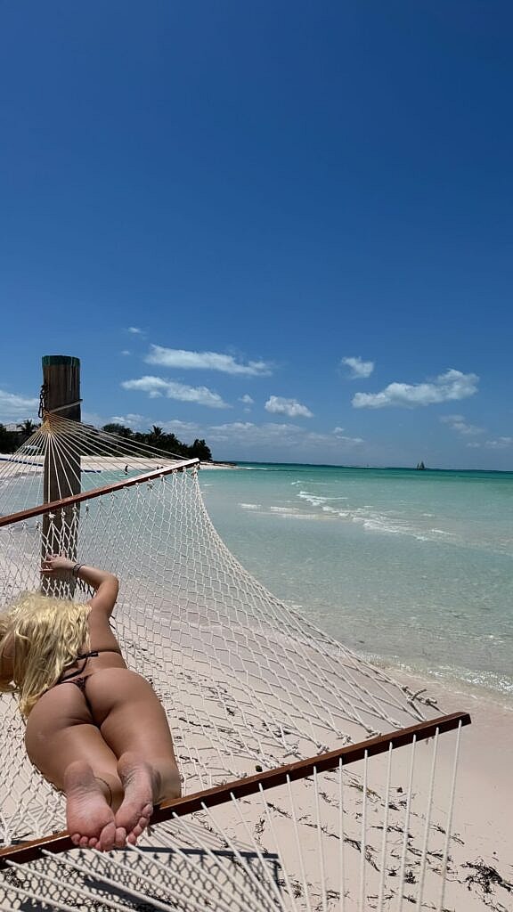 Alabama Barker puts on a cheeky display in her bikini while in the Bahamas.