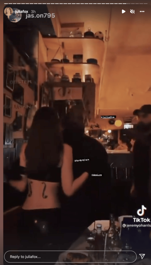 Julia Fox and Kanye West kissing.