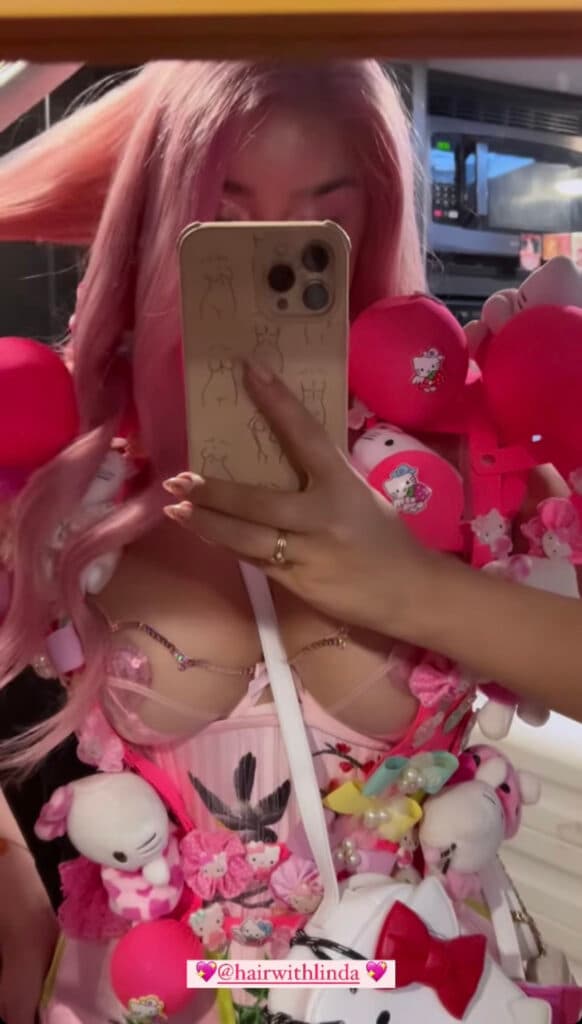Demi Rose taking a selfie.