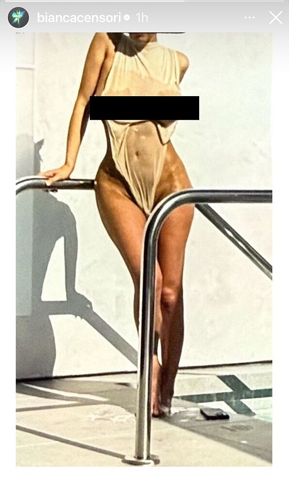 Bianca Censori posing poolside.
