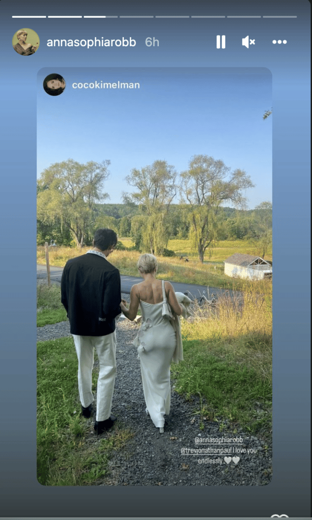 AnnaSophia Robb and Trevor Paul walking near the water