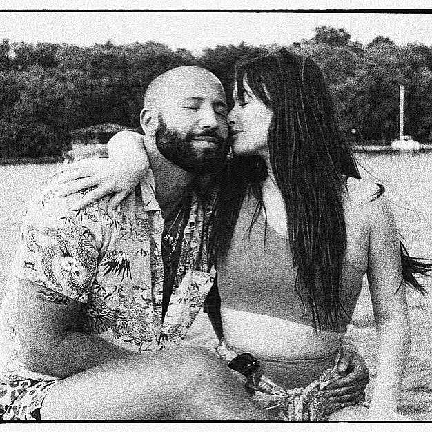 Kacey Musgraves kissing Cole Schafer's face