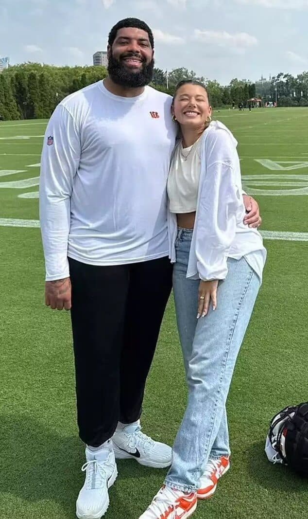Cody Ford and Tianna Robillard on football field