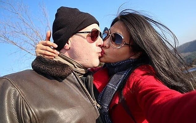 Eric Rosenbrook kissing his wife