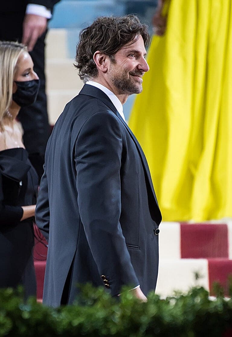Bradley Cooper in a dark suit at a formal event
