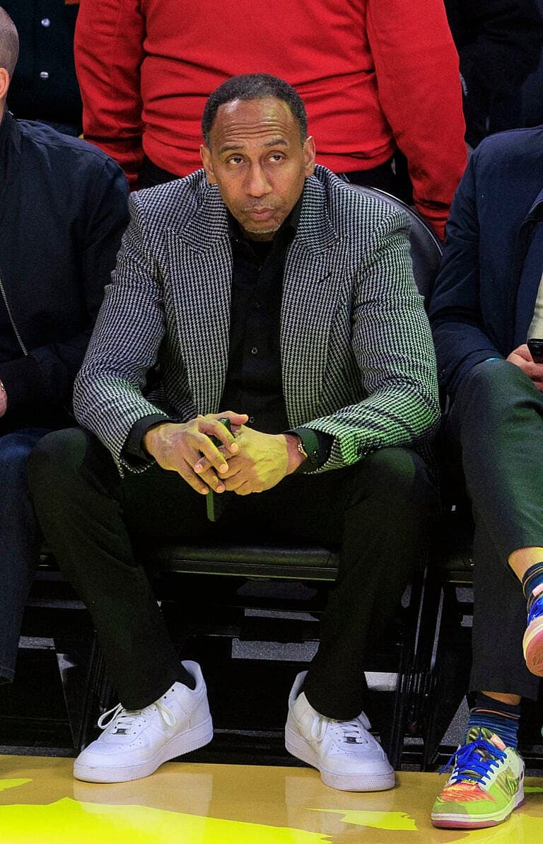 Stephen A. Smith Blasts WNBA Coach Cheryl Reeve Over Transgender Debate 2 Stephen A. Smith sitting court side.