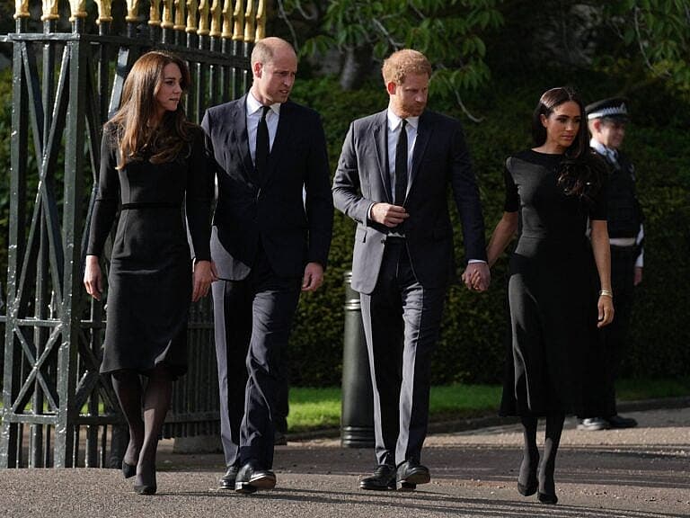 The Prince and Princess of Wales along with Prince Harry and Meghan Markle the Duke and Duchess of Sussex view the tributes at Windsor