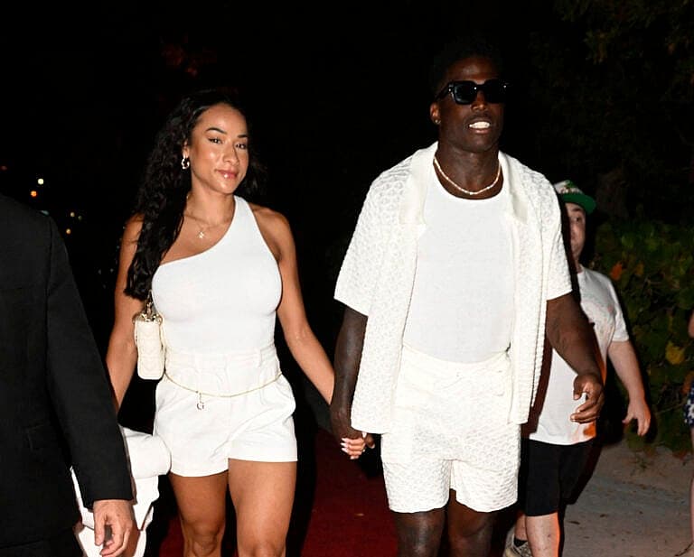 Tyreek Hill and his wife Keeta Vaccaro are seen arriving to Carbone beach tent during Miami F1 Grand Prix weekend