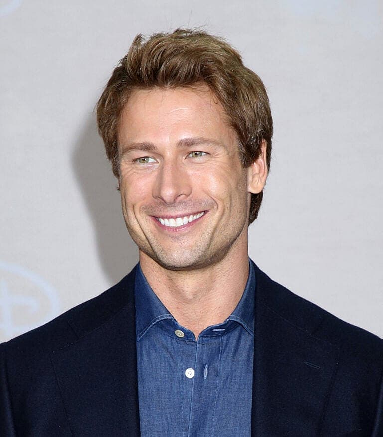 Glen Powell smiling