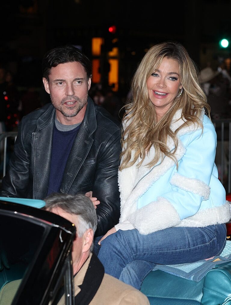 Denise Richards and husband Aaron Phypers seen at the 91st Hollywood Christmas Parade