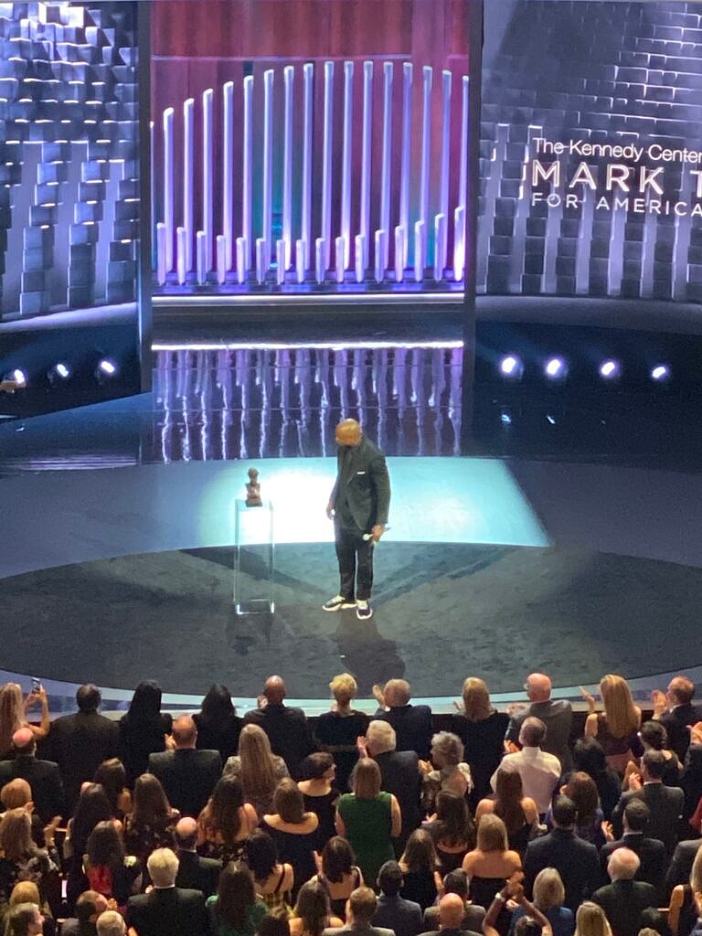 Dave Chappelle on stage to receive the Mark Twain Prize