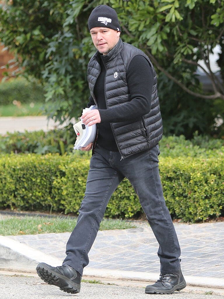 Actor Matt Damon busy with scripts strolling in Brentwood