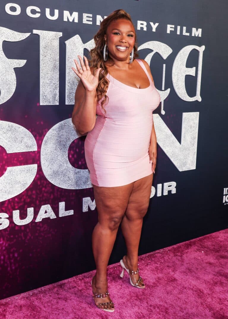 Lizzo Puts Her 60-Pound Weight Loss On Display In A Striking Blue Corset Outfit At amfAR Gala 2 Lizzo at the Los Angeles World Premiere Of 'Infinite Icon: A Visual Memoir'