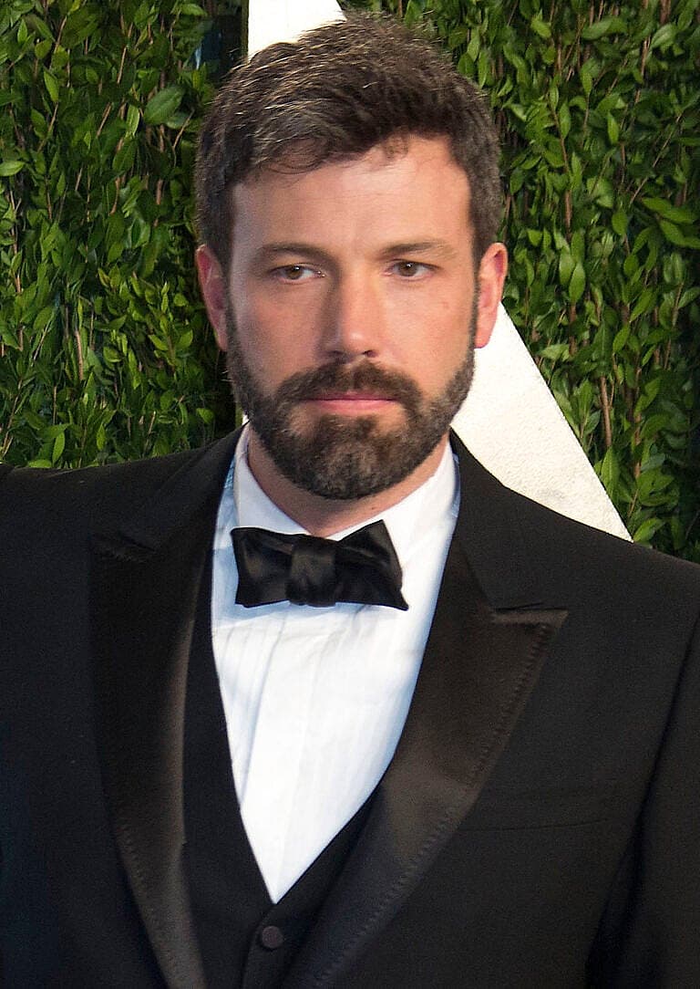 Ben Affleck in formal black tuxedo with bow tie at an event