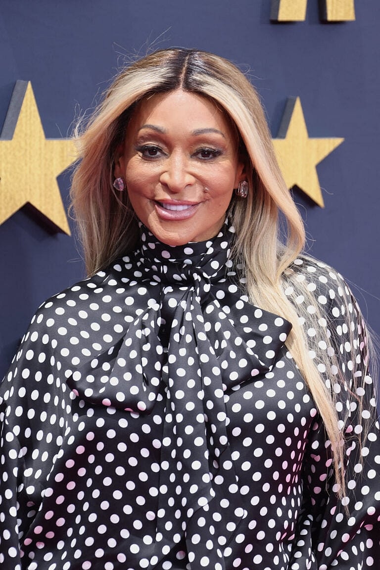 Wearing a black and white dress.