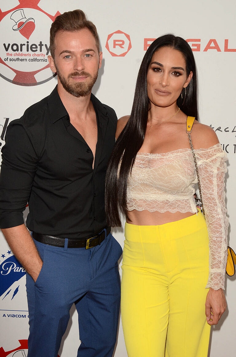 Artem Chigvintsev, Nikki Garcia attend the 9th Annual Variety Charity Poker & Casino Night