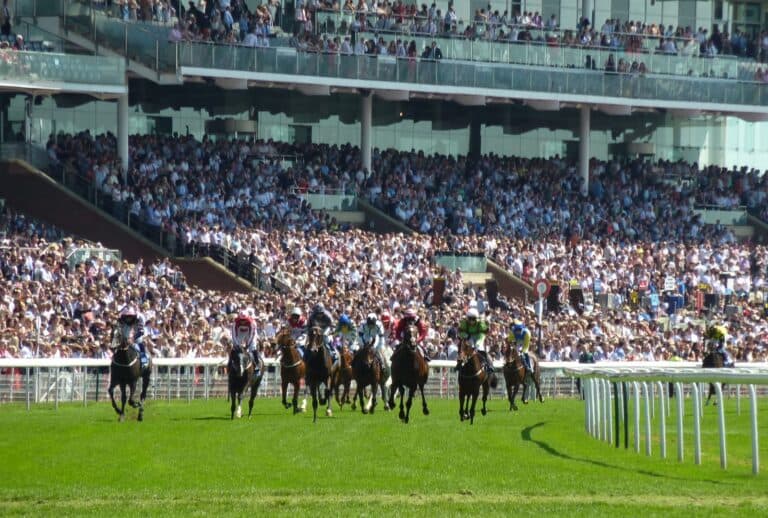 Horses Racing Around The Track