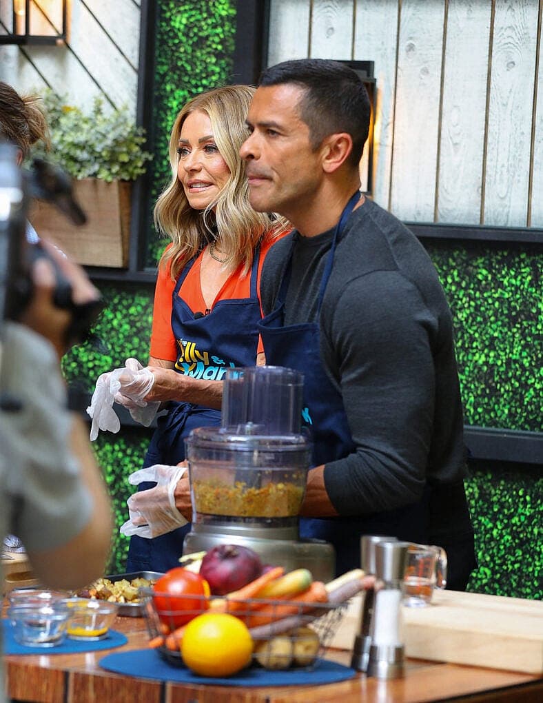 Kelly Ripa and Mark Consuelos seen eating a burger while filming the Live With Kelly And Mark Show on Jul 30, 2024