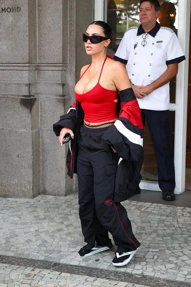Kim Kardashian spotted in Rio de Janeiro wearing Havaianas Flip Flops and white socks with a very small red tank top showing lots of skin
