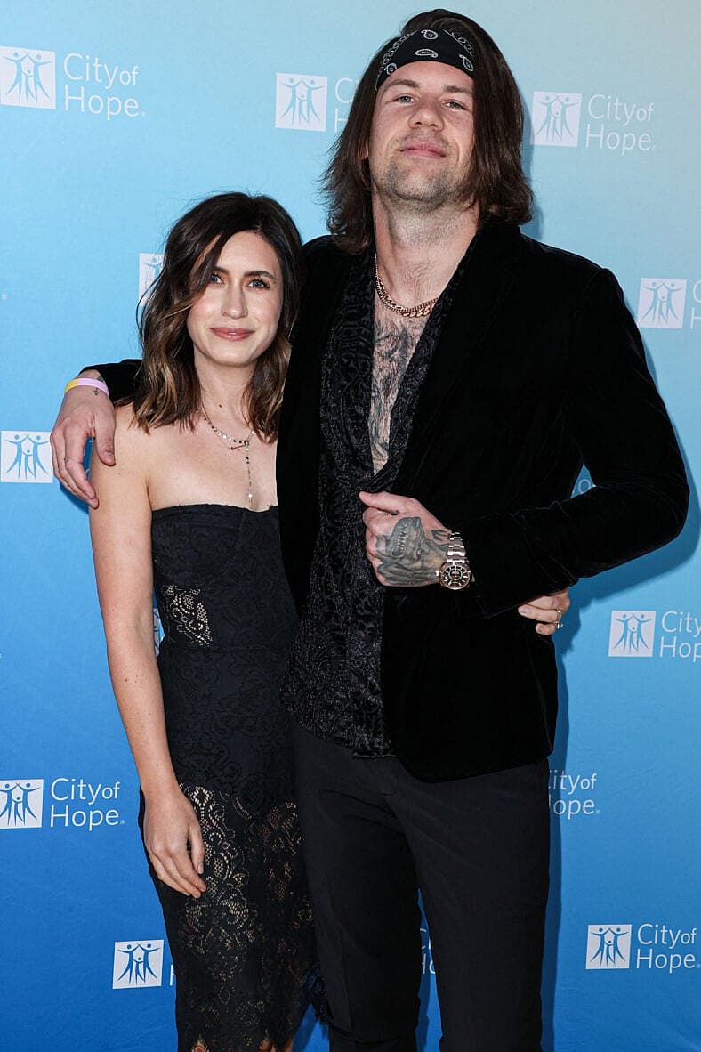 Caleb Shomo posing with his wife, Fleur Shomo.