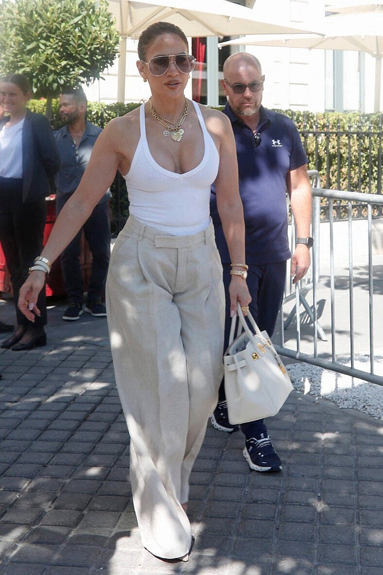 Jennifer Lopez and her sister Linda leaving their hotel during Paris Fashion Week