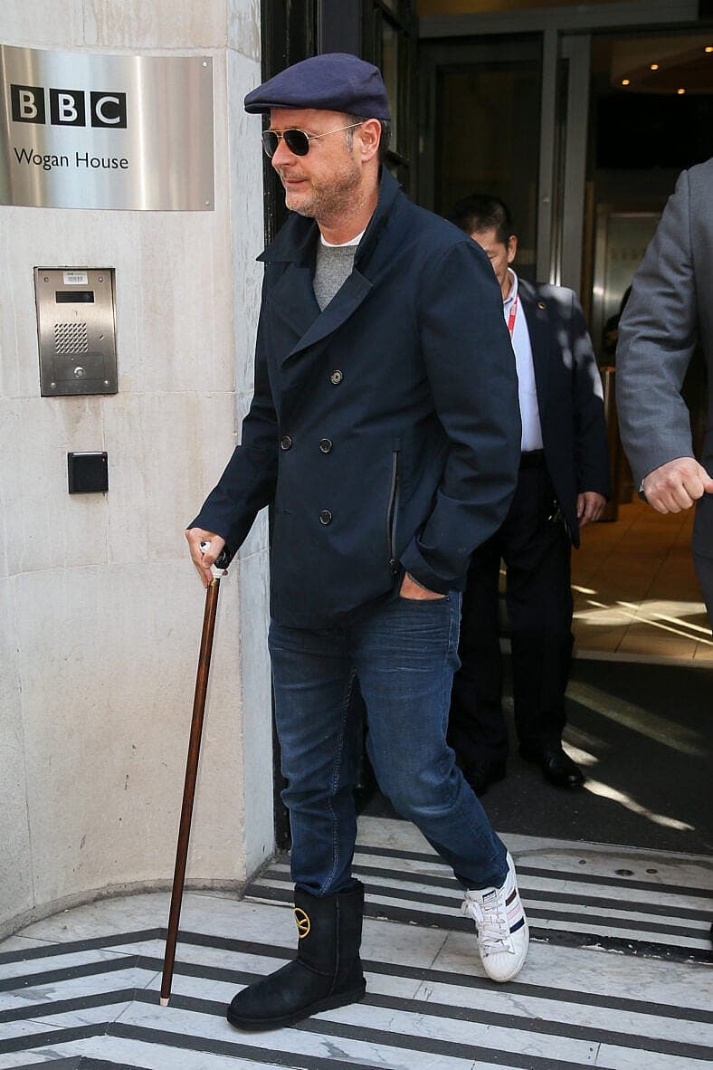 Matthew Vaughn looked in pain with his right foot as he leaves BBC Radio Two studios