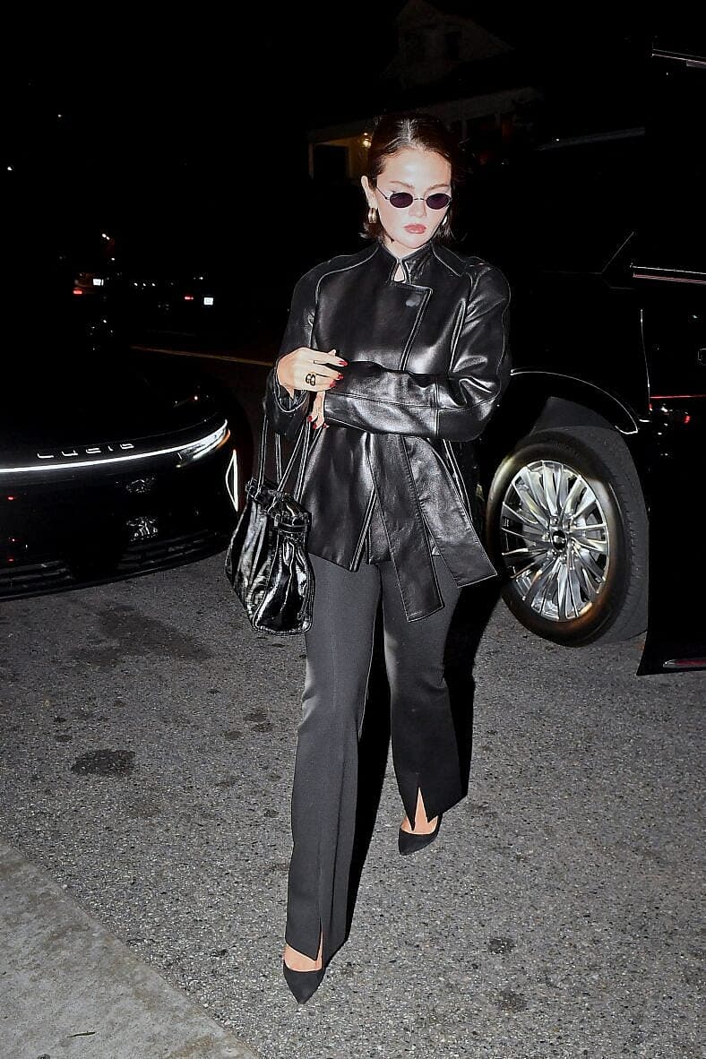 Selena Gomez wears all black as she arrives at San Vicente Bungalows