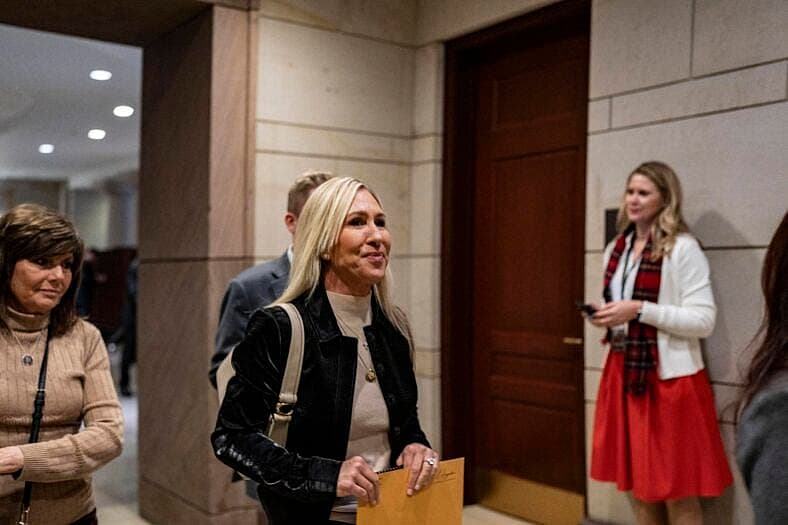 Representative Marjorie Taylor Greene walks out after the classified briefing
