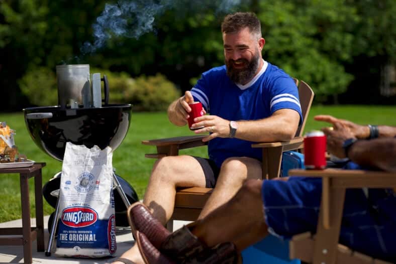 Jason Kelce settles into retirement and denim dungarees as he learns how to be “King of the Grill” with Kingsford Charcoal