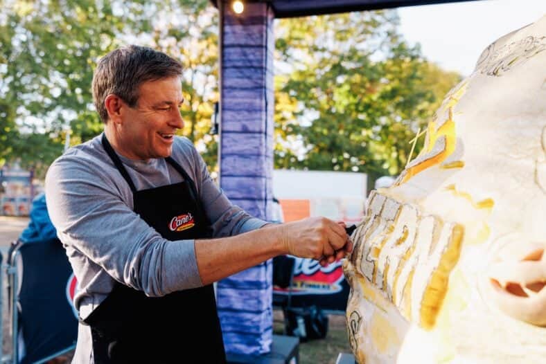 Raising Cane's owner and founder Todd Graves completes carving for Guiness World Record heaviest Jack o'lantern at Salem Common on October 27, 2026