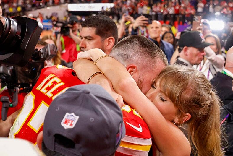 Taylor Swift embraces beau Travis Kelce after the Kansas City Chiefs win the super bowl beating the San Francisco 49ers 25-22.
