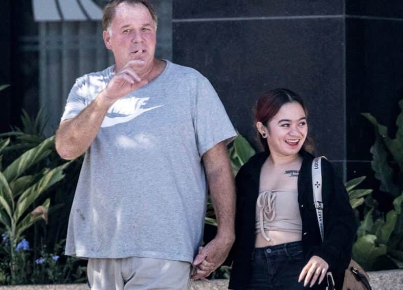 Meghan Markle half-brother Thomas Markle Jnr pictured hand-in-hand with a woman outside the apartment building where he lives with his father in the Philippines on 10th May 2025