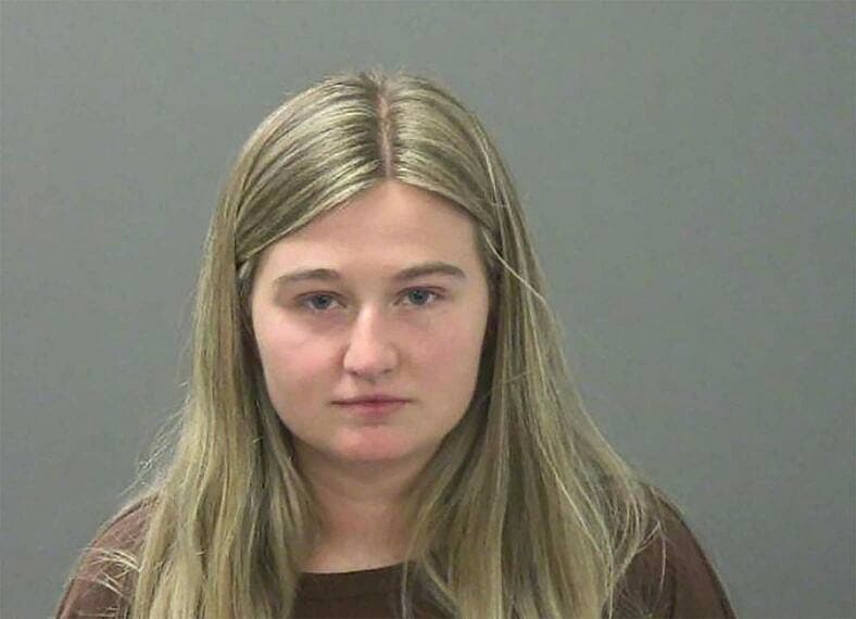 Booking photo of Kendra Duggar who is now facing criminal charges alongside her husband, Joseph Duggar, after Arkansas police announced additional counts in the ongoing investigation.