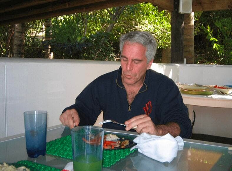 Jeffrey Epstein posing with a 'Champion' Belt with his name on it and with what appears to be a child in these undated photo released by the U.S. Department of Justice