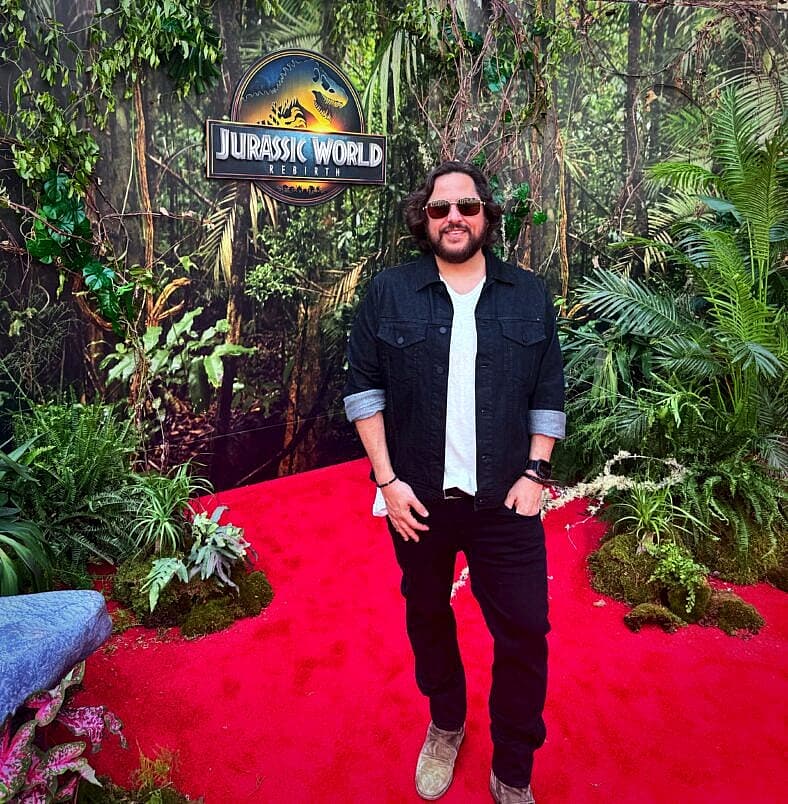 Ben Lamm in front of Jurassic Park sign