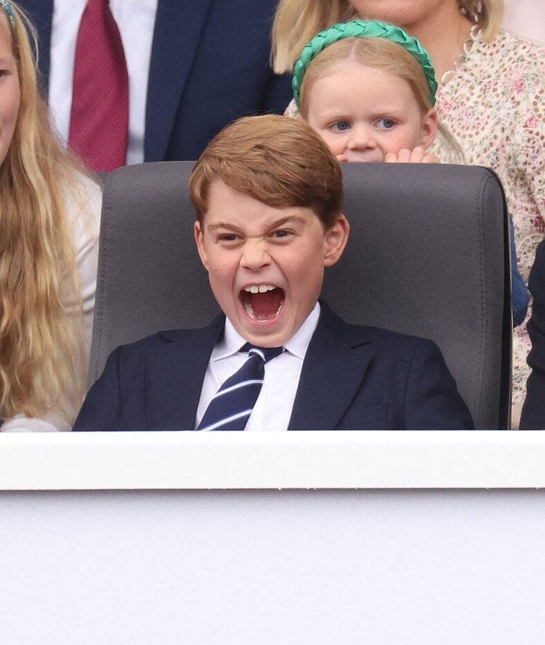 Prince George of Cambridge and Prince William, Duke of Cambridge watch the Platinum Pageant 