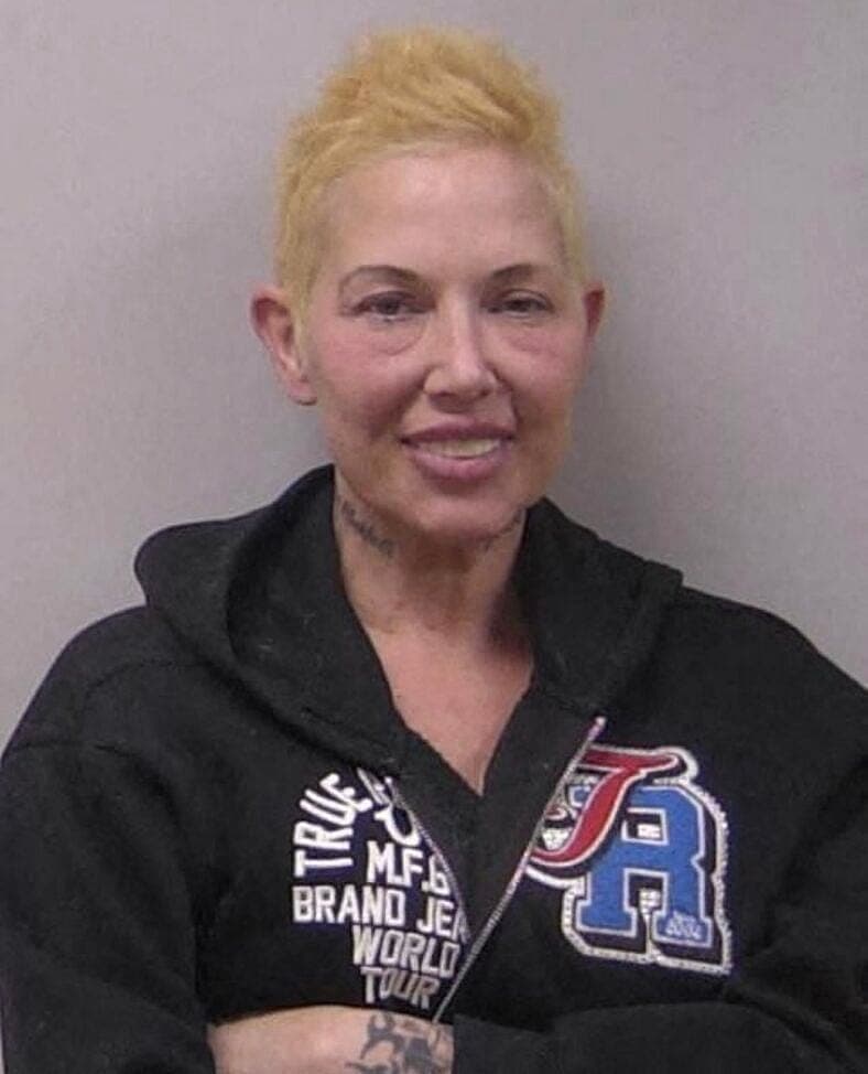 Eminem's ex-wife Kim Scott smiles in mug shot after second DUI arrest on May 14