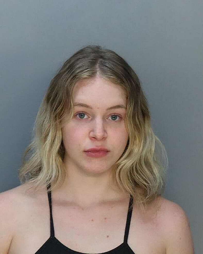 Courtney Clenney booked into Miami jail accused of murdering her boyfriend - see her mugshot.