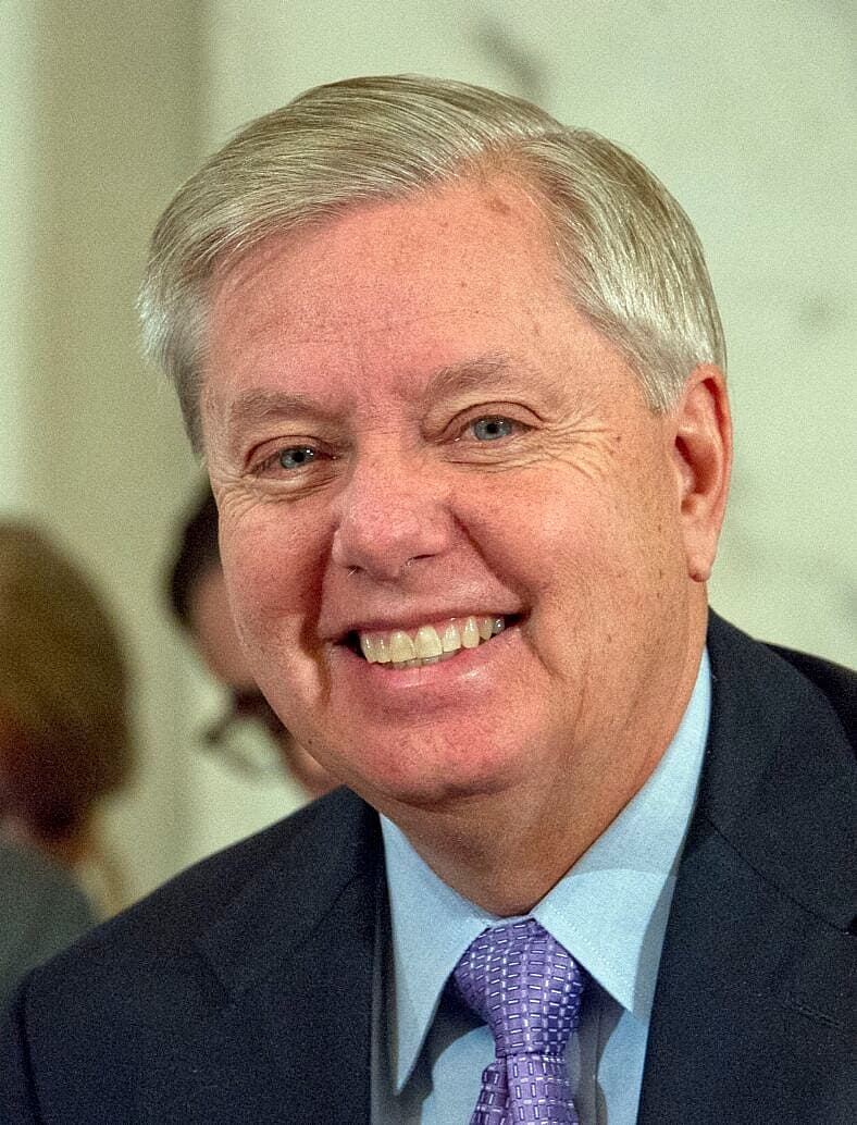 United States Senator Lindsey Graham (Republican of South Carolina) listens as Loretta Lynch, United States Attorney For The Eastern District Of New York