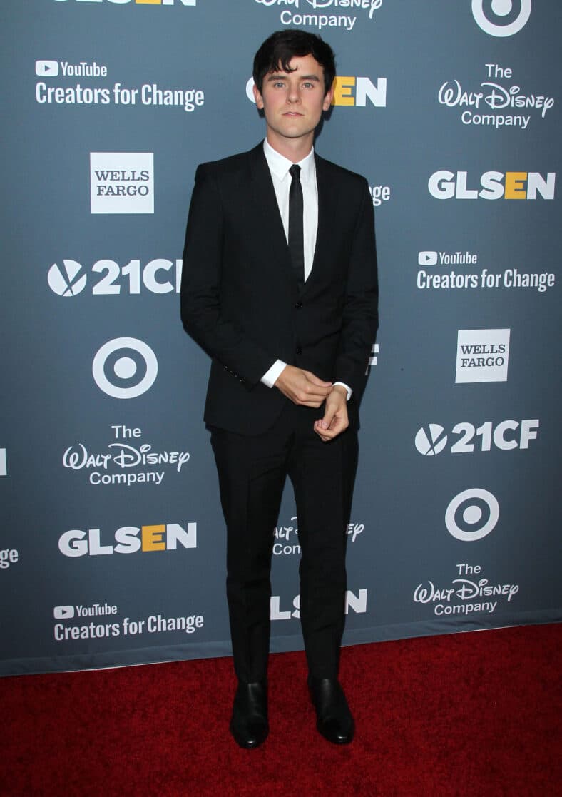 Connor Franta posing on the red carpet.