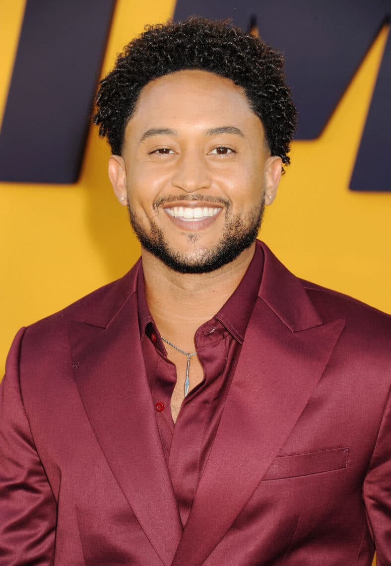 Tahj Mowry posing on the red carpet. 