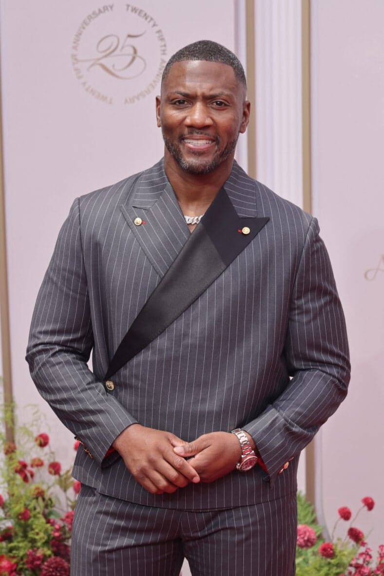 Ryan Clark posing on the red carpet. 
